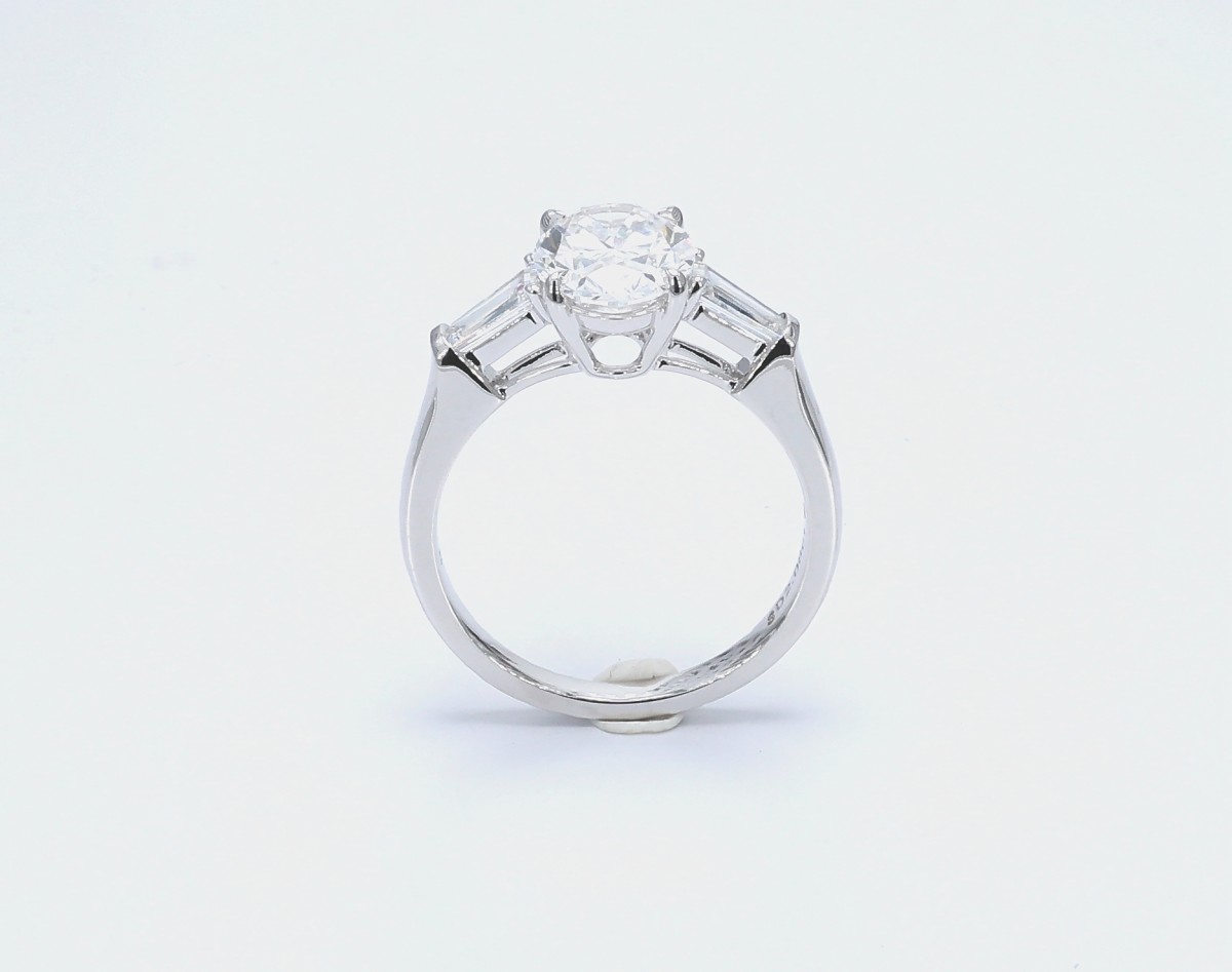 2.575 ct. tw. Oval Cut Center Stone & 2 Emerald Side Stones Engagement Ring side views
