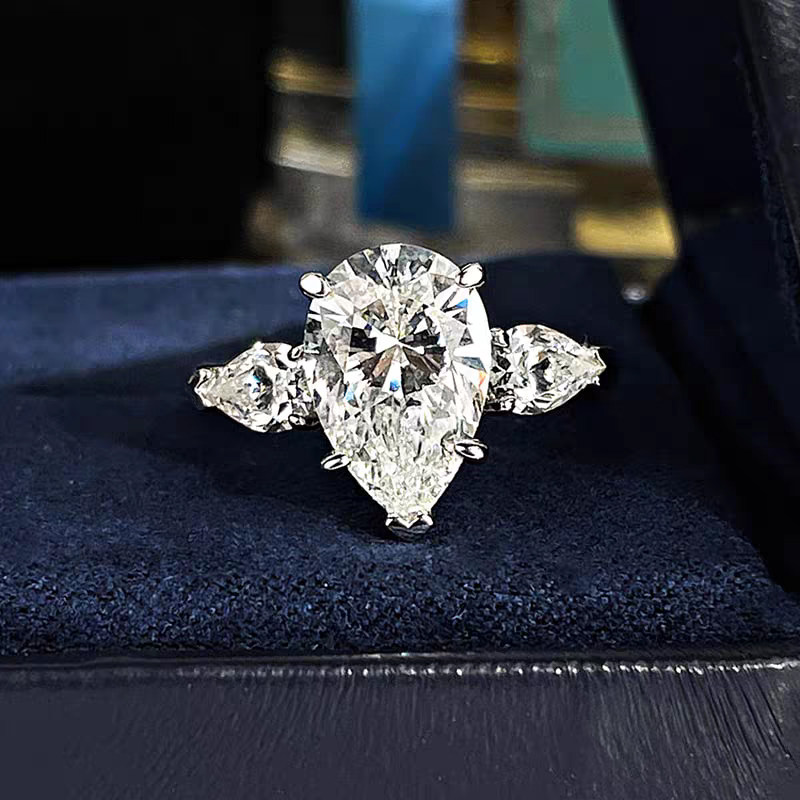Three Pear Stone Lab Cultured Diamond Engagement Ring With Beveled Band detail view