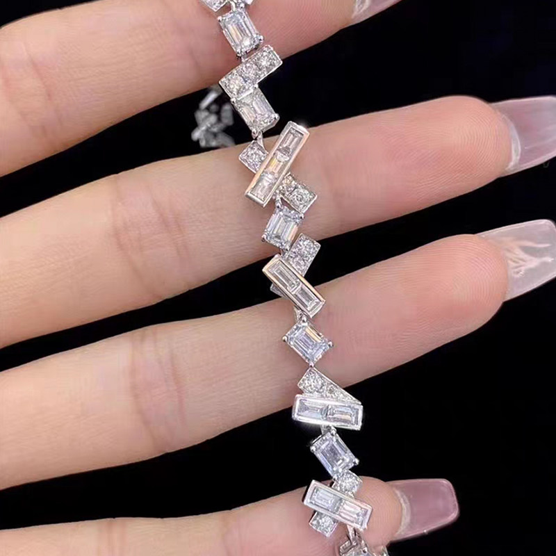Alternating Crisscross Baguette Pave Linear Lab Diamond Bracelet in hand
