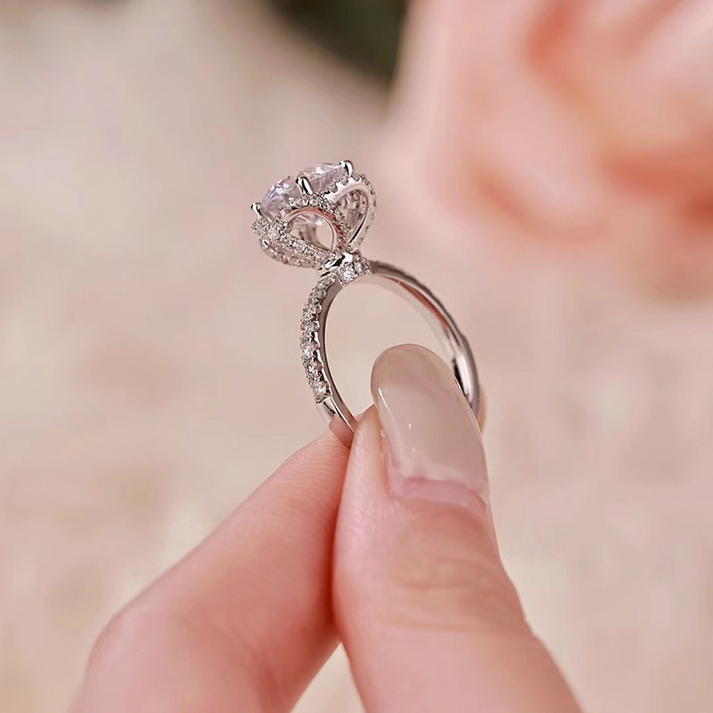 Brilliant Round Main Stone Hollow Floral Halo Engagement Ring With Half Pave Band Side View