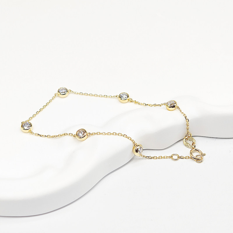 6 Alternating Bubble Bezel Set Lab Created Diamond Bracelet in Yellow Gold lay on table whole view
