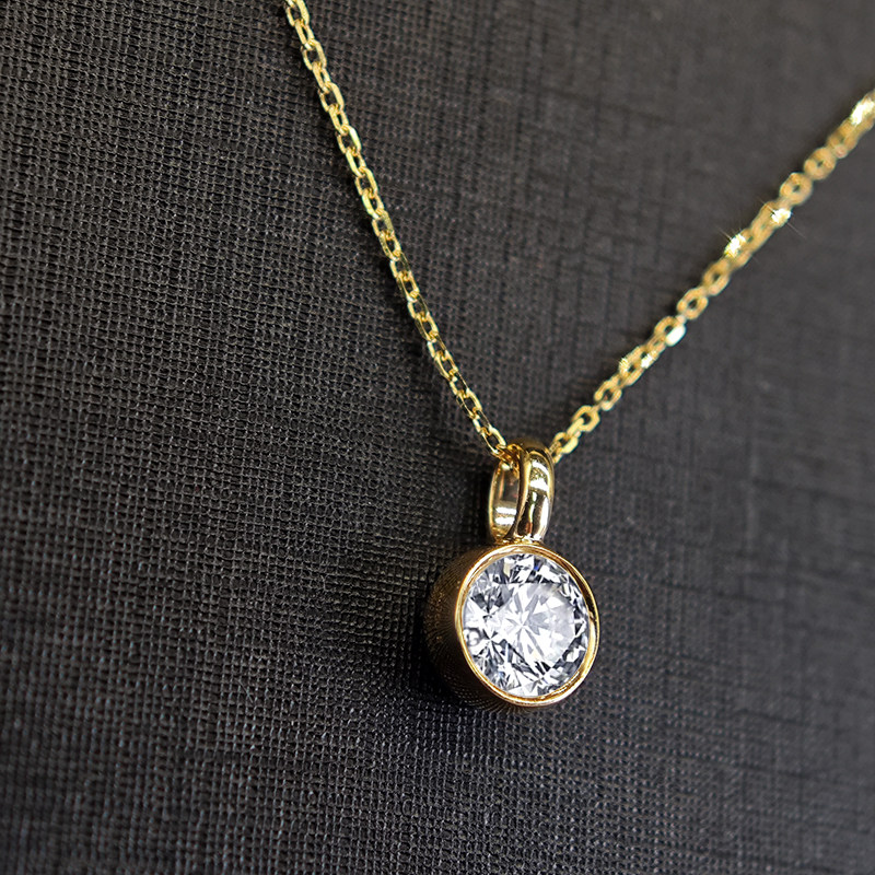 Solitaire Round Bezel Spring Ring Clasp Man Made Diamond Necklace in black background