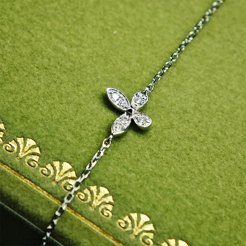 Alternating Petite Butterfly Motif Pave Cultivated Diamond Necklace on green box