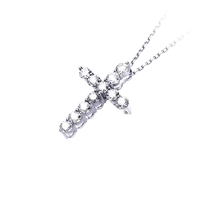 Full Pave Cross Motif Pendant White Gold Necklace lay on table