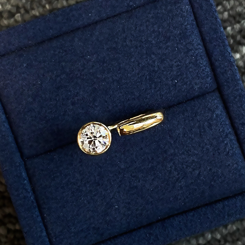 Round Cut Bezel Open Solitaire Diamond Ring With Polished Squared-Side Band top view