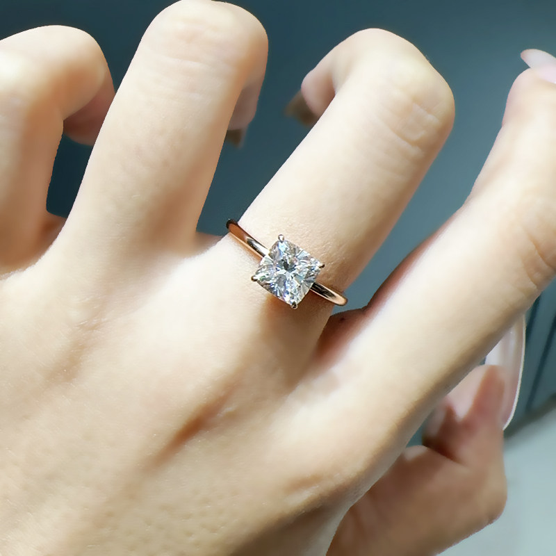 4 Prong Cushion Cut Minimalist Solitaire Diamond Ring With Polished Slim Round Band wear effect