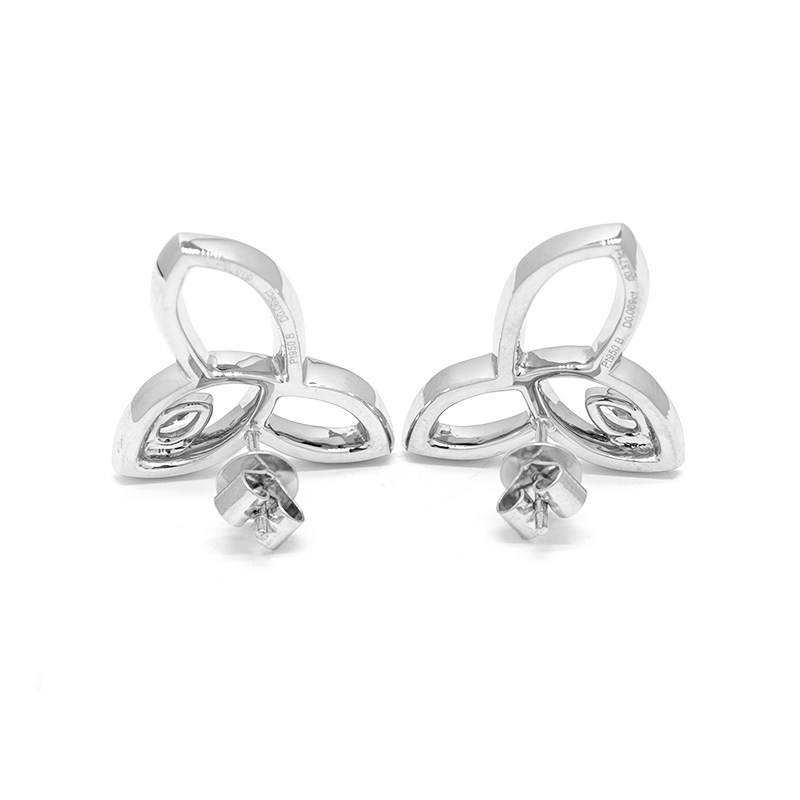 Close-up of trinity hollow leaf pave lab grown diamond stud earrings