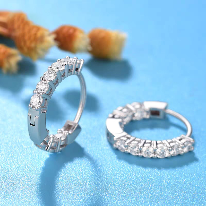 Dual Face Pave Ethical Lab Grown Diamond Huggie in White Gold In blue background