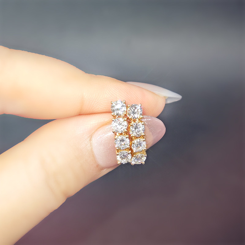 Linear Shaped Four Round Cut Dual Layer Open Gallery Diamond Stud Earring in hand
