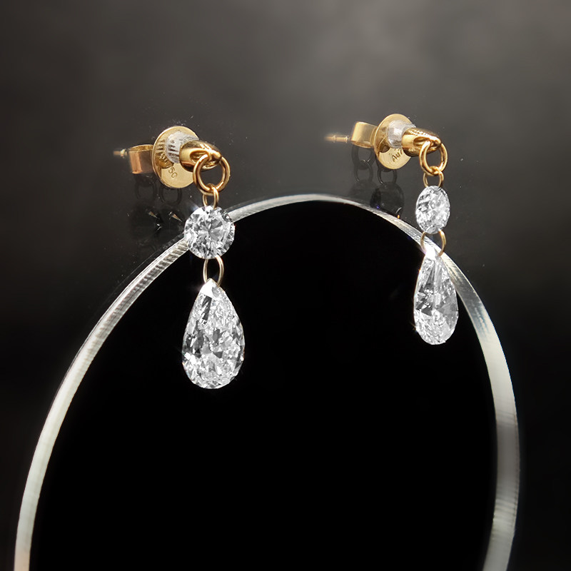 Classic Pierced Pear Cut Stone Drop Earring With Pierced Side Stone &amp; Yellow Gold Stud close up
