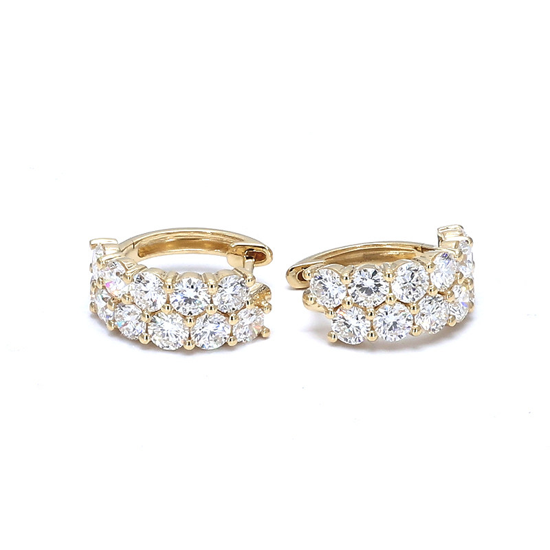 Double Row Half Pave Lab Cultured Diamond Yellow Gold Huggie Earring lay on desk