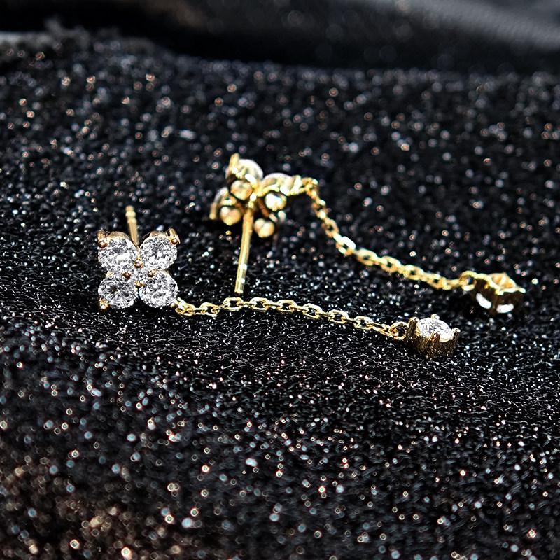 Four Leaf Clover Stud &amp; Long Chain Drop 4 Prong Lab Diamond Earrings on table