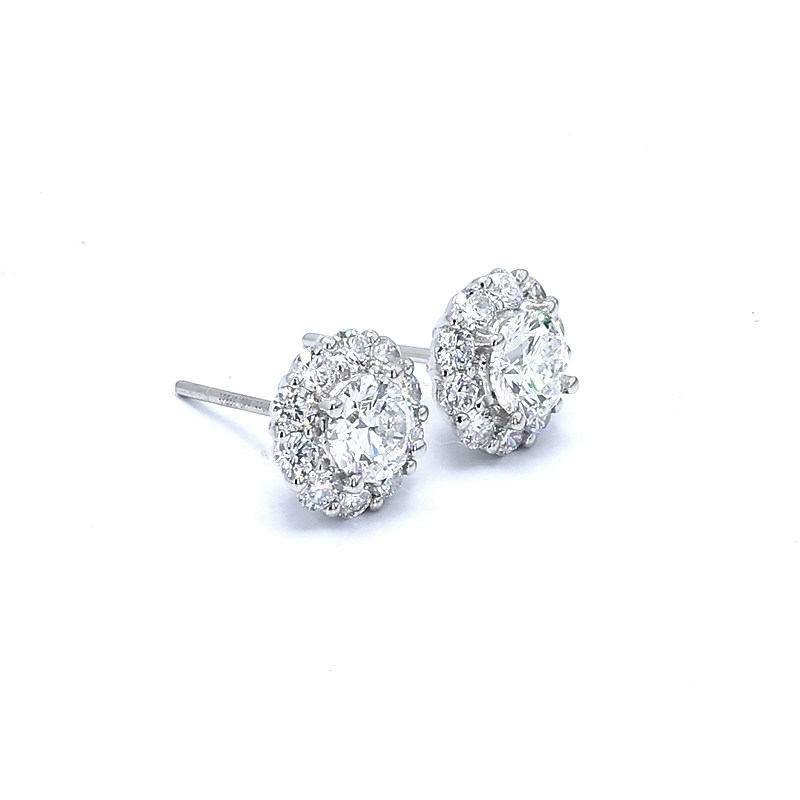 Bud Head Round Cut Halo Open Gallery Lab Grown Diamond Stud Earrings lay on table