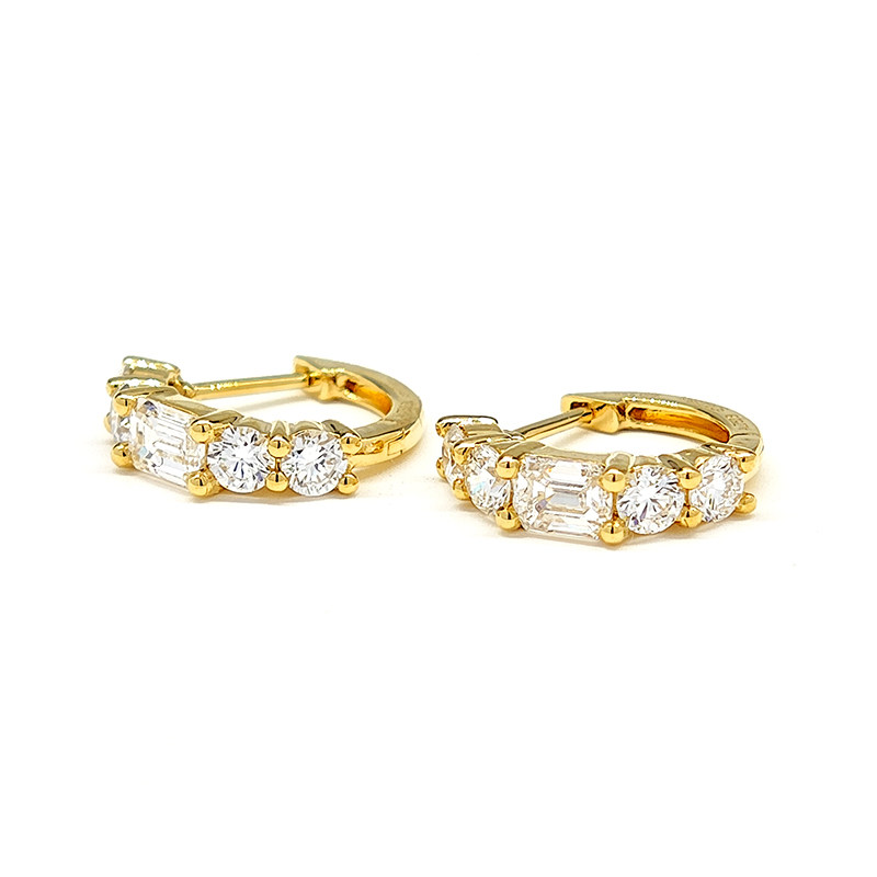 5 Stone Emerald &amp; Round Cut Lab Cultured Diamond Yellow Gold Hoops lay on table