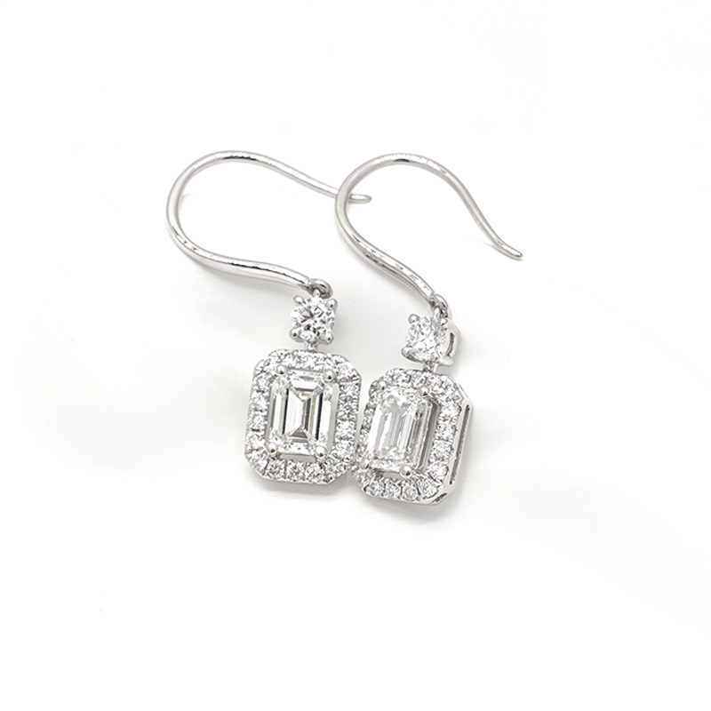 Emerald Cut Solitaire Halo Side Stone Drop Earrings With Ear Wire close up