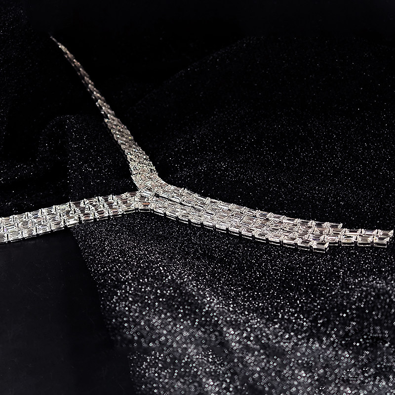 Baguette Cut Lab Diamond Y-Drop Fringe Statement Necklace lay on table
