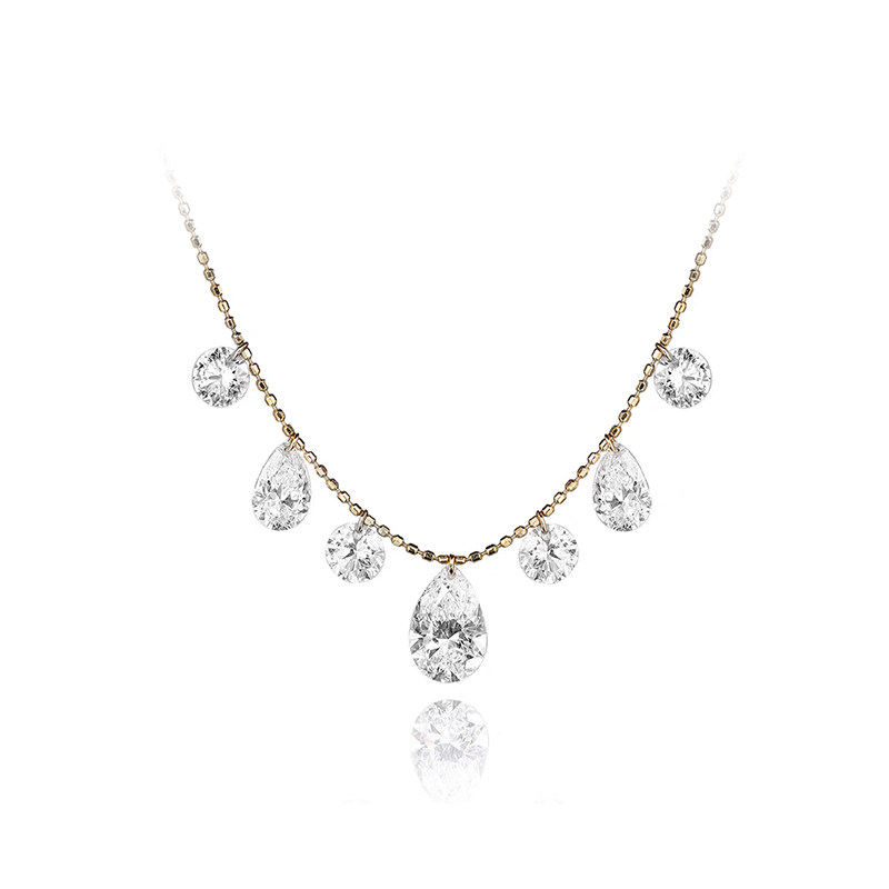 7 Alternating Round & Pear Shaped Pierced Diamond Necklace in blank background