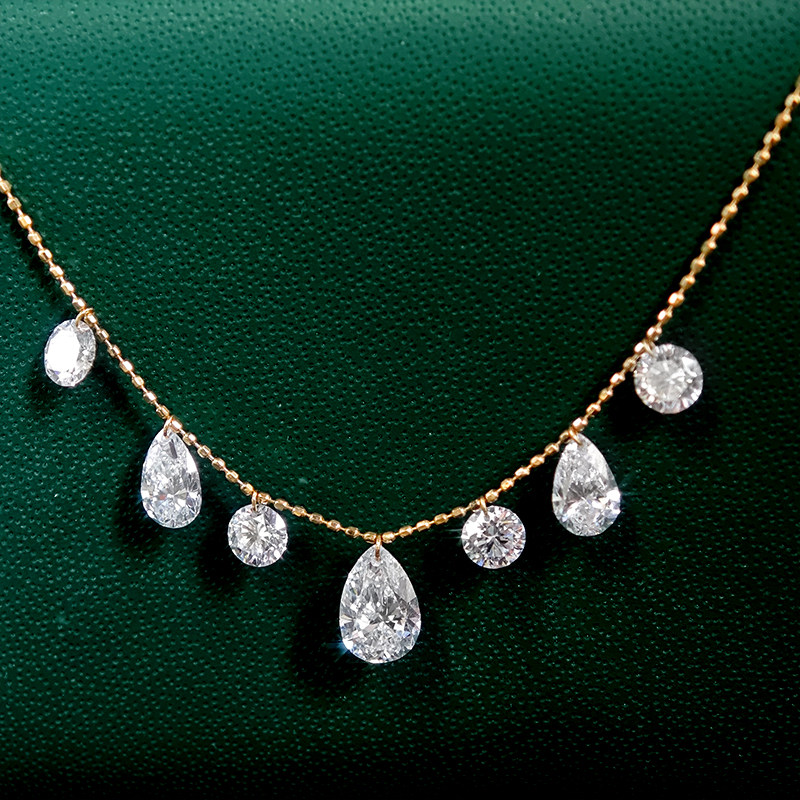 7 Alternating Round & Pear Shaped Pierced Diamond Necklace wearing effect close view
