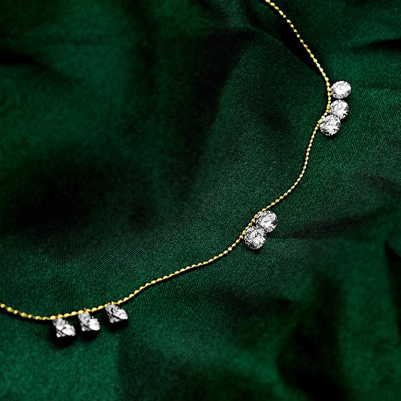 8 Pierced Man Made Diamonds Alternating Adjustable Necklace With Beads Chain on green cloth