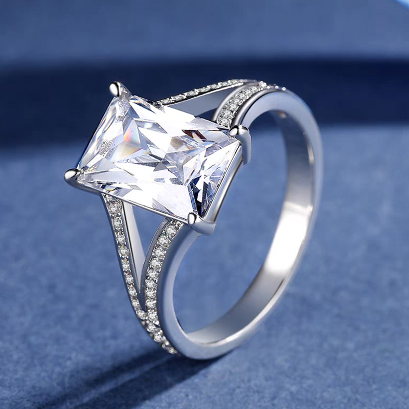 Solitaire Emerald Cut 4 Prong Diamond Ring With Half Channel Pave Split Shank