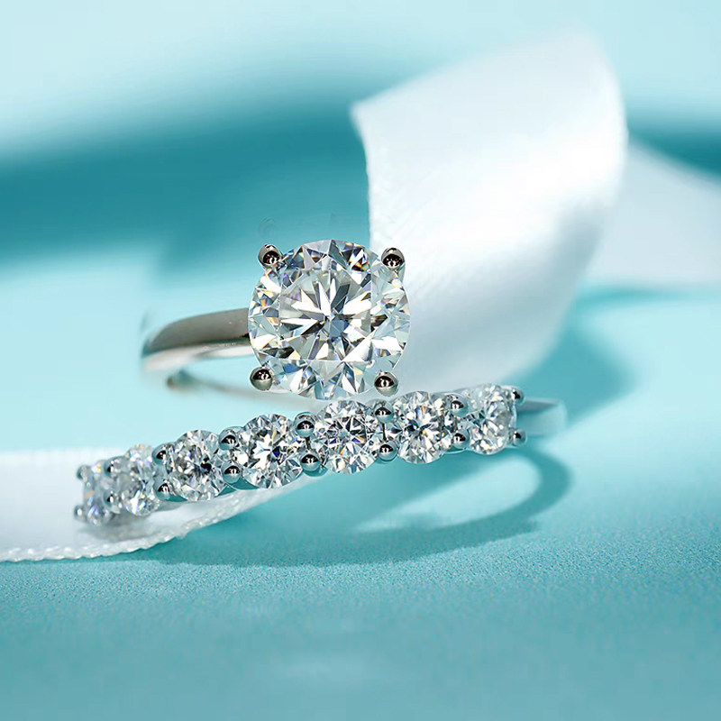 4 Prong Solitaire Round Cut Diamond Ring With Single Row Quarter Pave Bypass Band effect