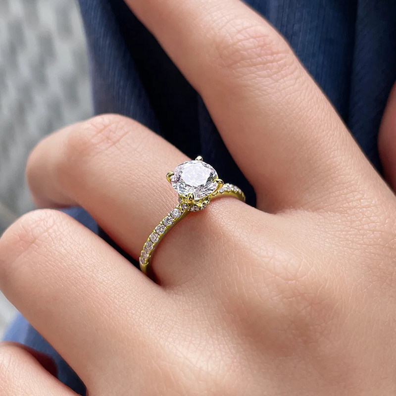 4 Prong Brilliant Round Cut Solitaire Diamond Ring With Half Pave Band wearing effect