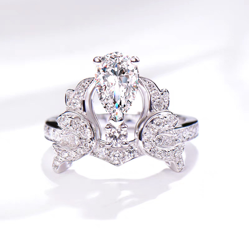 Crown Inspired Pear Cut Main Stone Diamond Ring With Half Pave Shank
