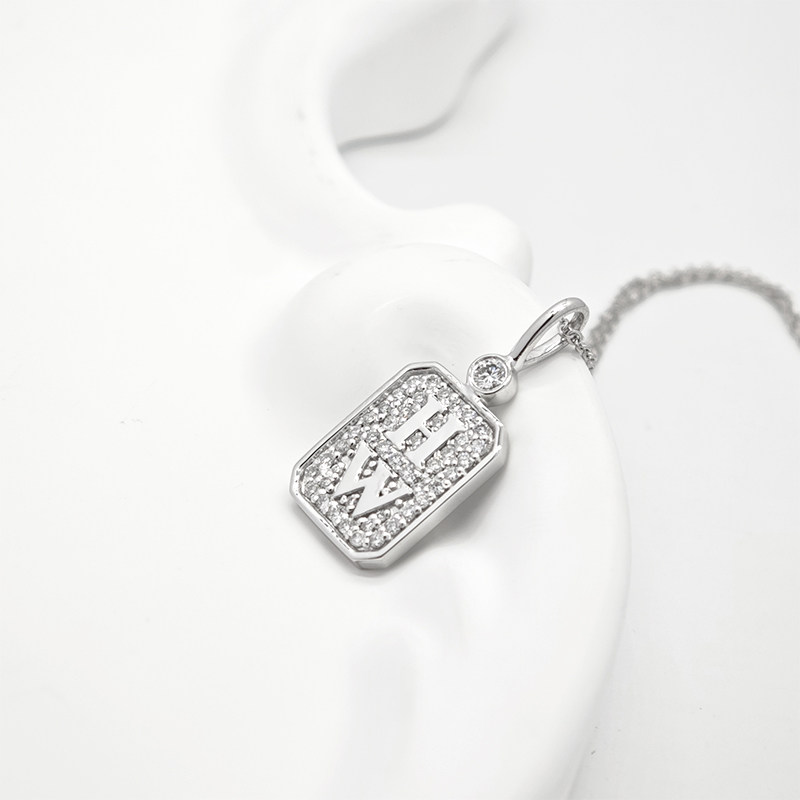 Custom Letters Chamfered Rectangle Full Pave Diamond Medallion Pendant Necklace lay on table