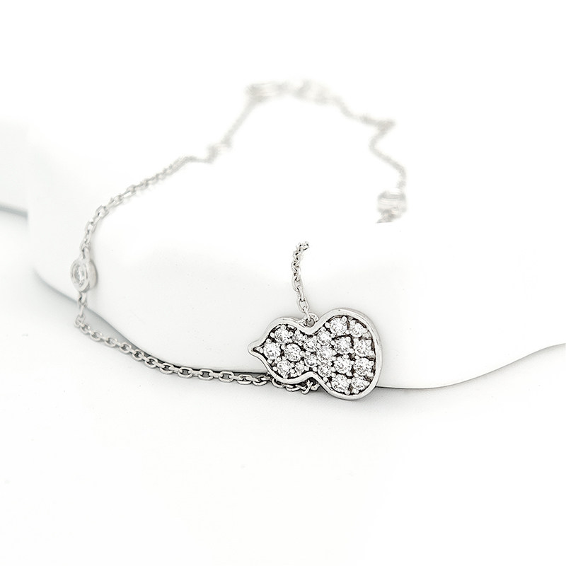 Gourd Shaped Pave Pendant Lab Diamond Necklace With Adjustable Chain Extender Chain lay on table