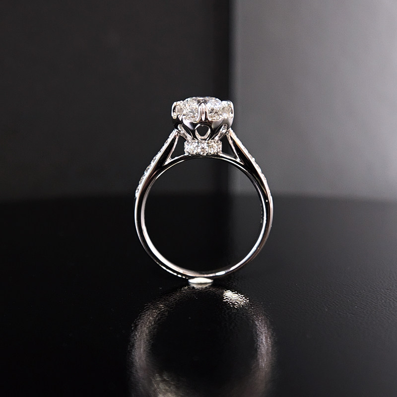 8 Prong Round Cut Halo Diamond Ring With Tapered Shoulder Half Pave Band side view