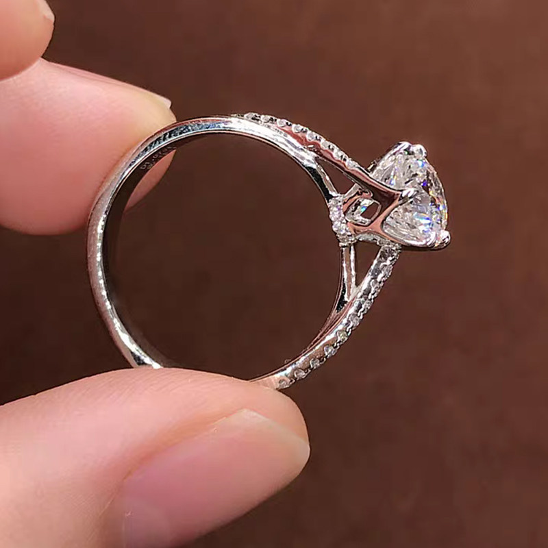 Four Prong Solitaire Hidden Halo Round Diamond Ring With Half Pave Cathedral Shank