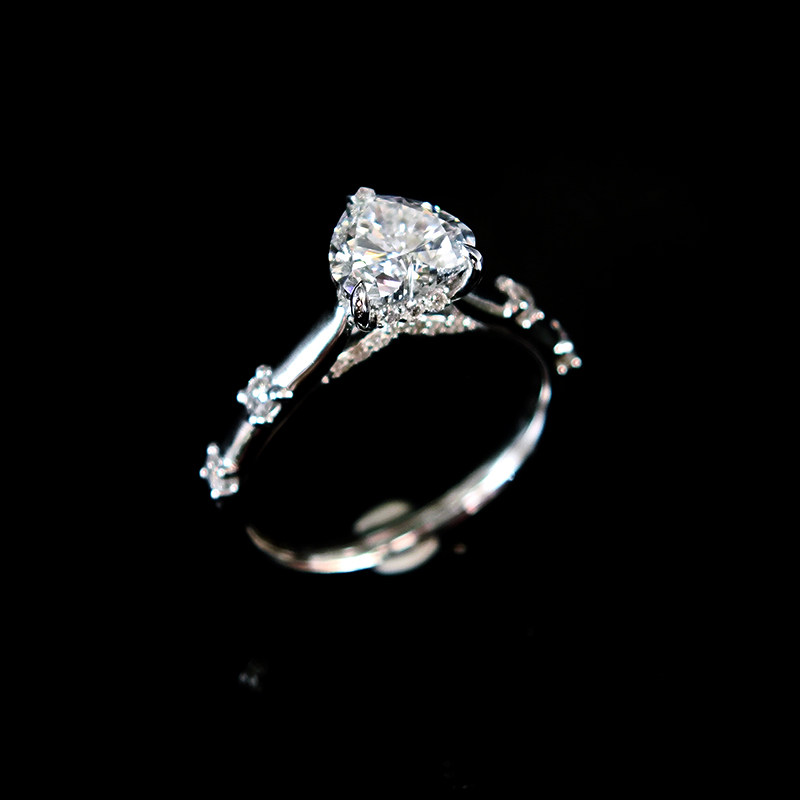 Heart Shaped Solitaire Cultivated Diamond Ring With Accents on Both Cathedral Shank side view