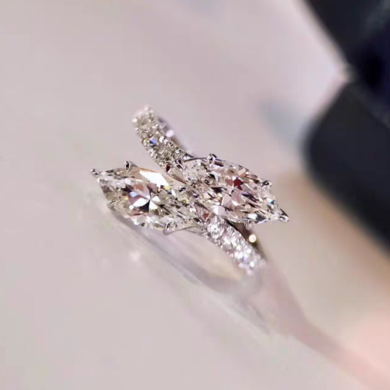 Two Brilliant Marquise Cut Diamond Ring With Half Pave Bypass Shoulder Shank