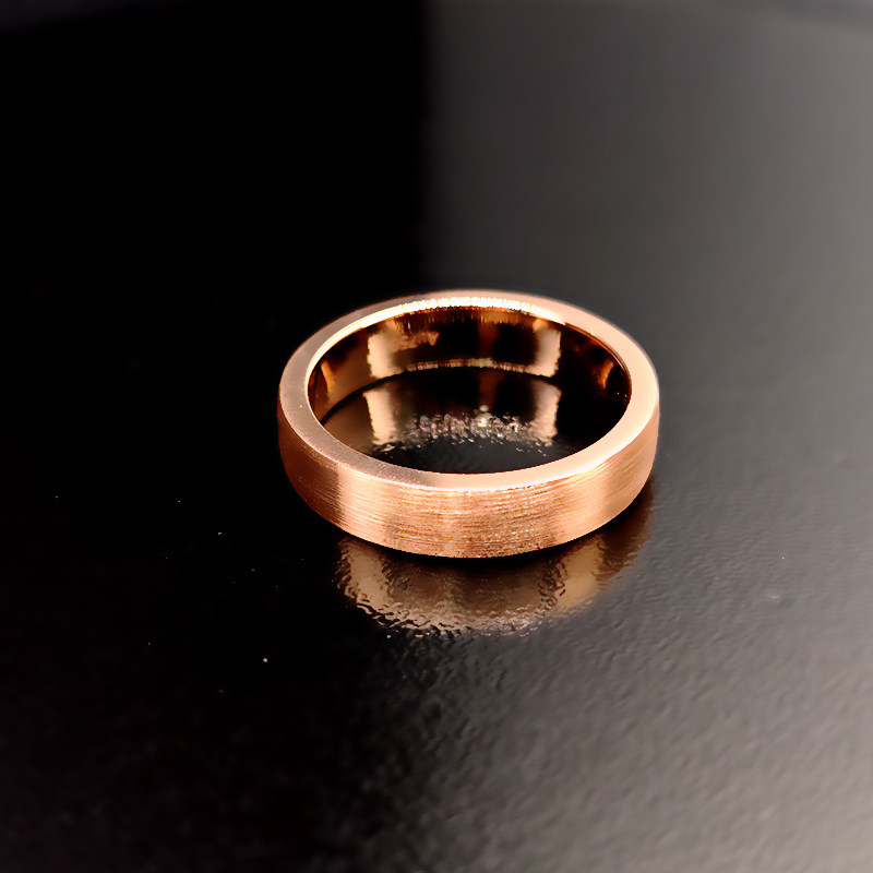Men's Perfect Fit Matte Brushed Textured Surface Wedding Band In Rose Gold on Table
