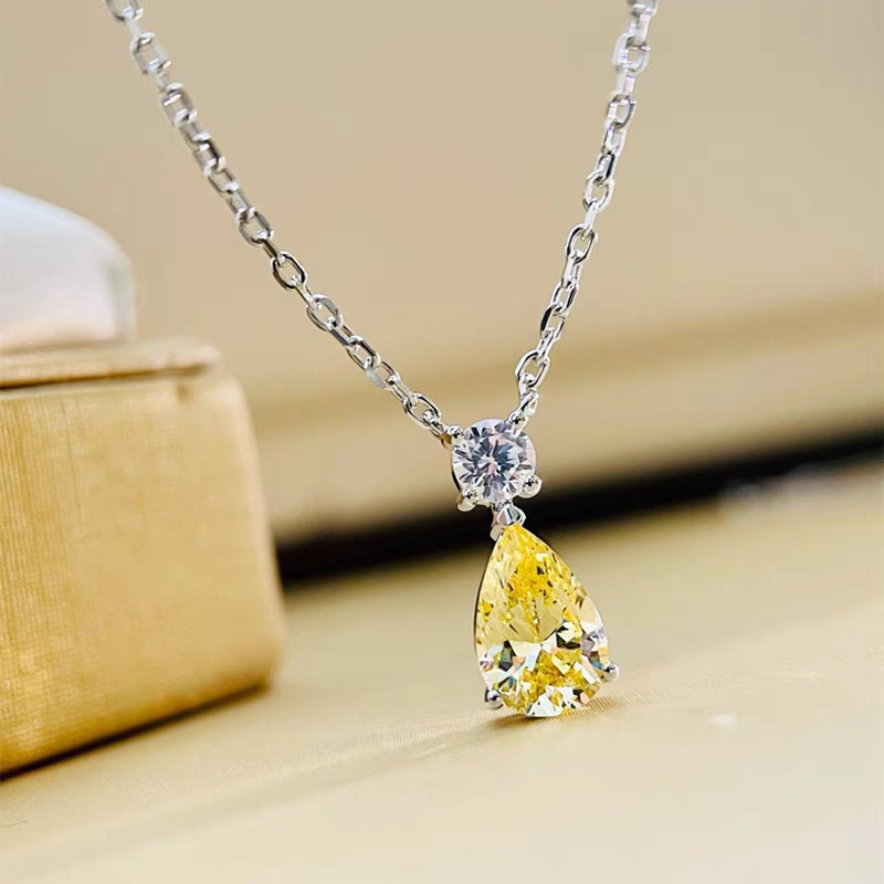 Minimalist 3 Prong Pear Cut Yellow Lab Diamond Necklace With Single Accent On Bail detail