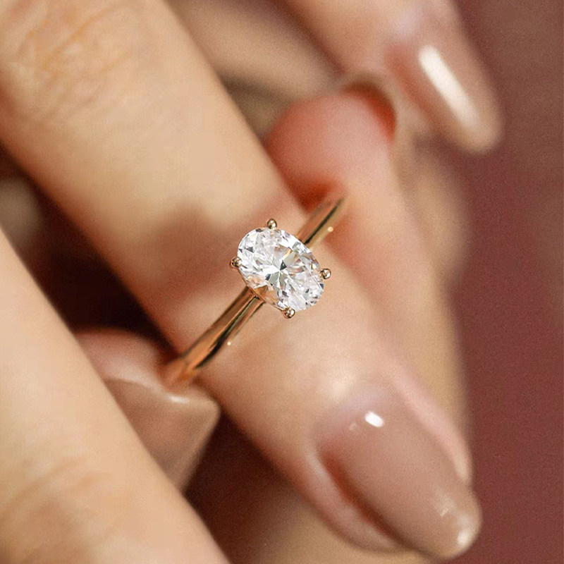 Minimalist Oval Cut 4 Prong Vertical Setting Engagement Ring With Plain Band wearing effect