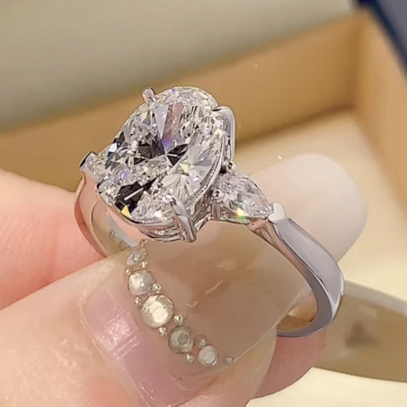 Oval Cut Main Stone with 2 Pear Cut Side Stone Lab Diamond Engagement Ring wear effect