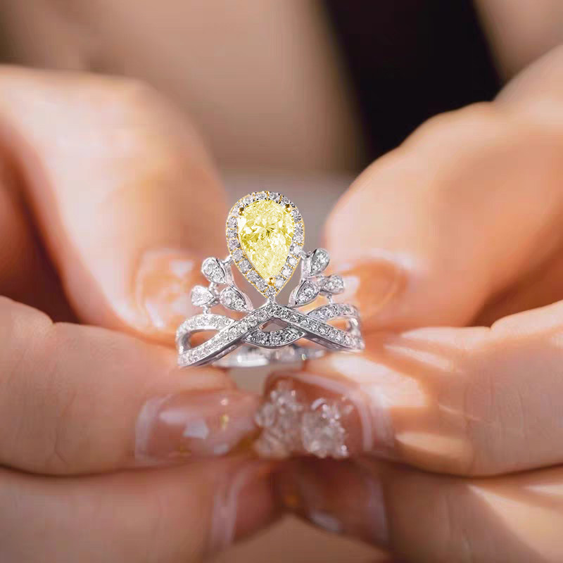 Crown Inspired Yellow Pear Cut Halo & Accents With Crisscross Staggered Overlapping Band