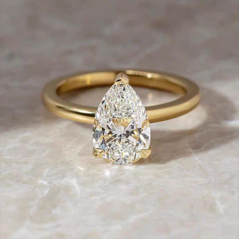 Teardrop 3 Prong Solitaire Man Made Diamond Ring With Polished Round Shank