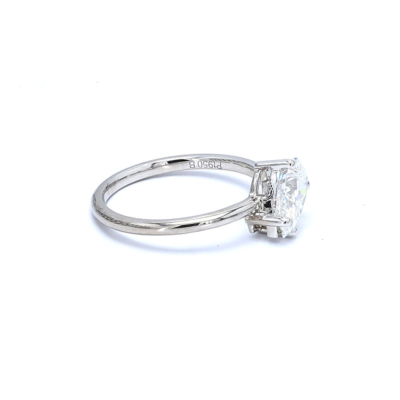 Pear Solitaire Slim Band White Gold Manufactured Diamond Minimalist Engagement Ring lay on table