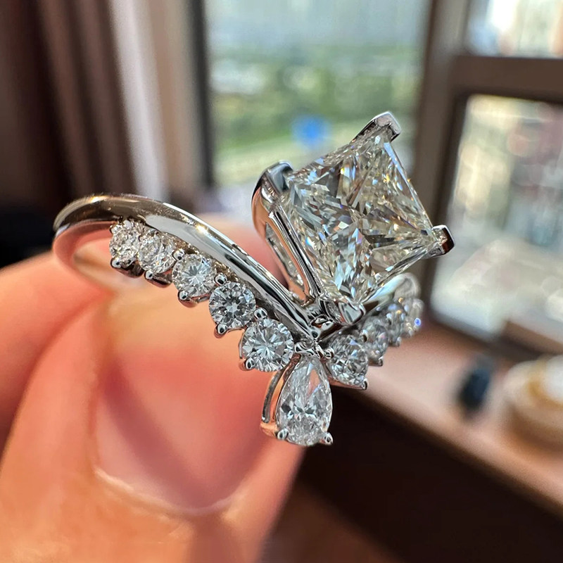Crown Inspired Princess Cut Lab Cultured Diamond Ring With Single Shoulder Pave Accents Shank in hand