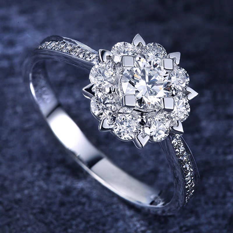 Floral Motif Round Center Stone Halo Diamond Ring With Tapered Pave Shoulder in black background