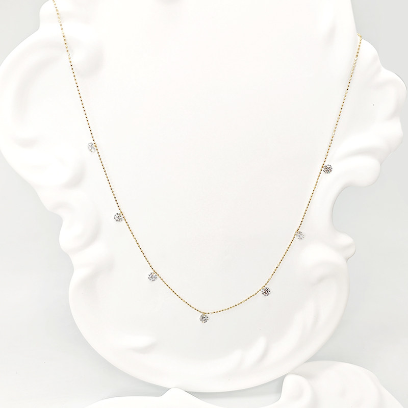 7 Pierced Round Cut Cultivated Diamonds Alternating Yellow Gold Necklace wearing effect