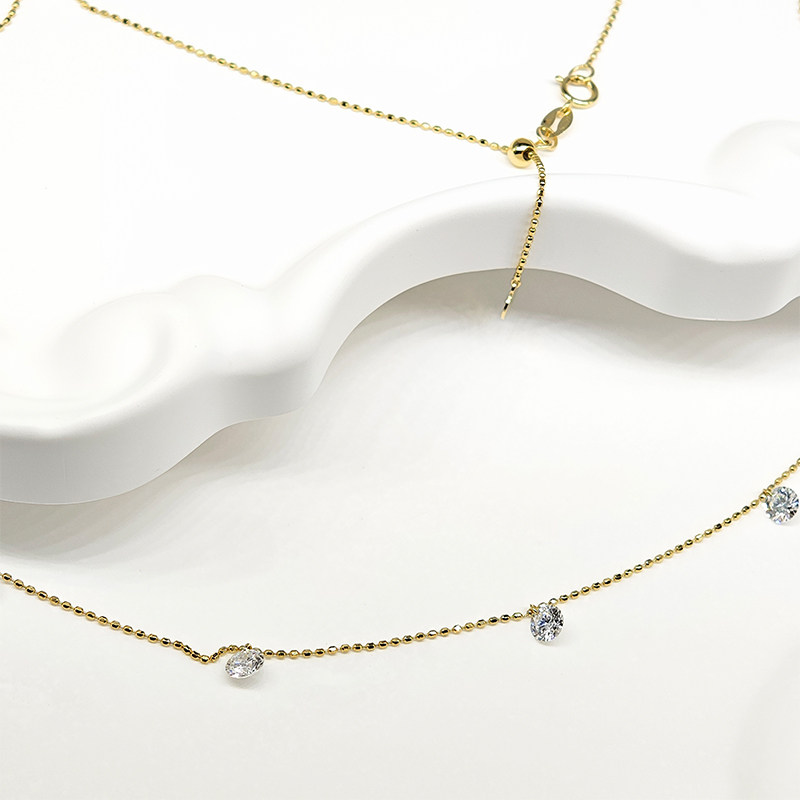 7 Pierced Round Cut Cultivated Diamonds Alternating Yellow Gold Necklace close-up