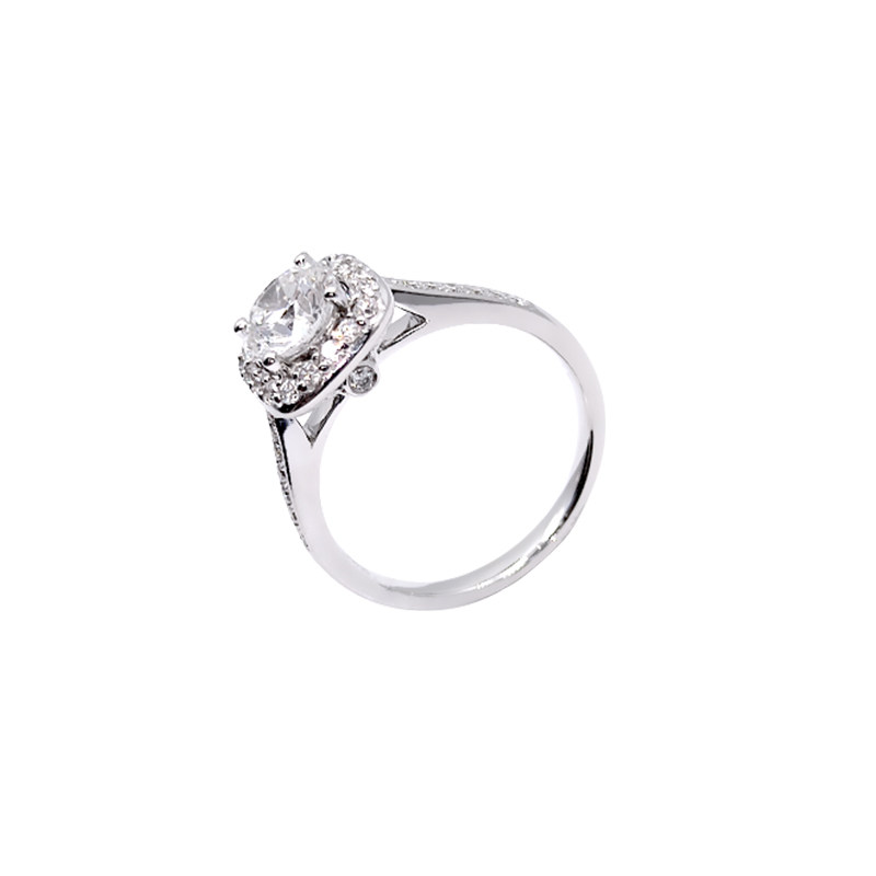 Single Round Cut Staggered Cushion Halo Diamond Ring With Half Eternity Polished Shank in blank background